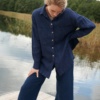 A model in navy blue wool linen blend button down