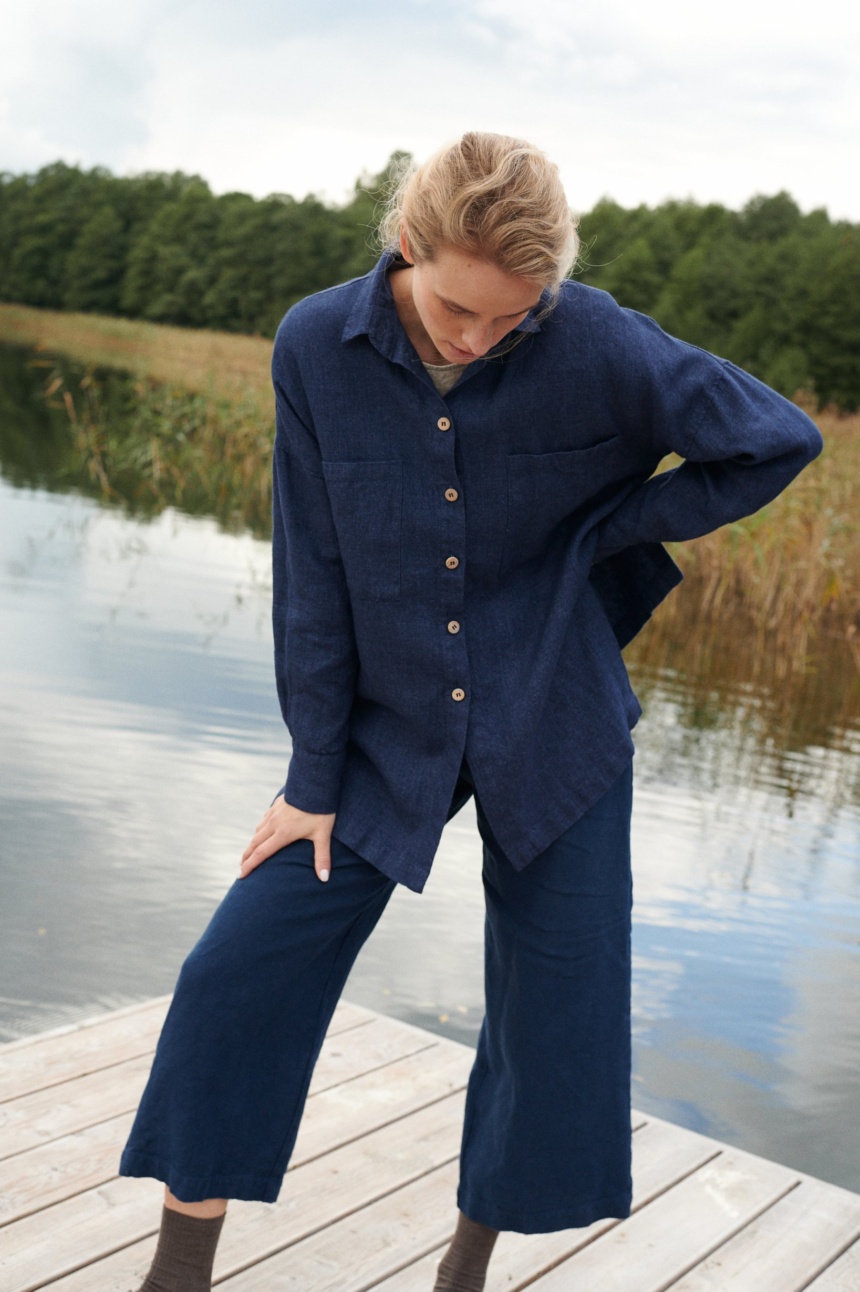 A model in navy blue wool linen blend button down