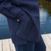 A woman in oversized wool blend shirt with side slits
