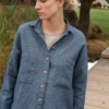 A woman in blue wool linen shirt with front pockets