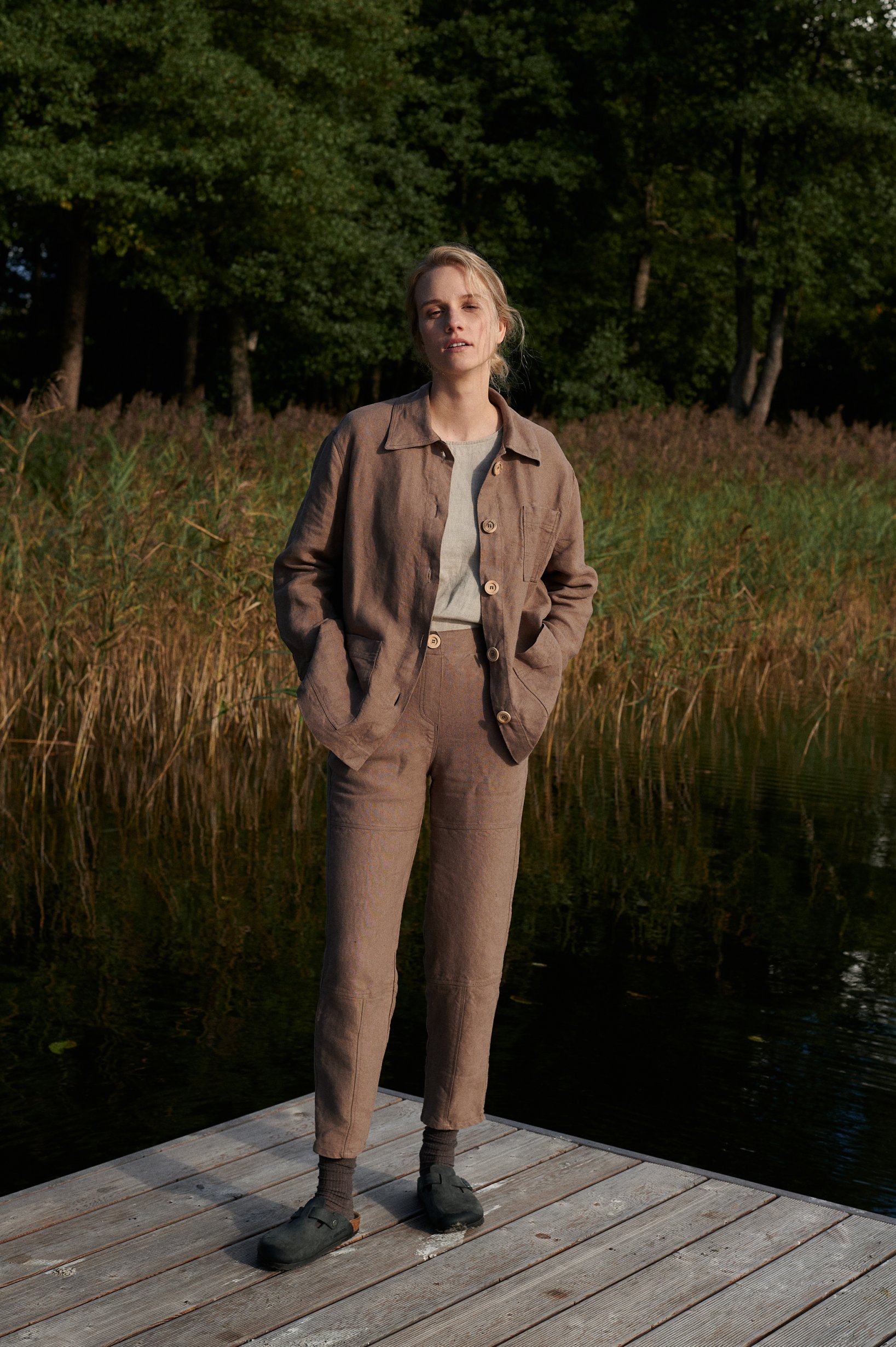 Unbuttoned brown heavy linen utility jacket and matching trousers