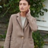 An oversized heavy linen blazer with notch lapels and a wooden closure