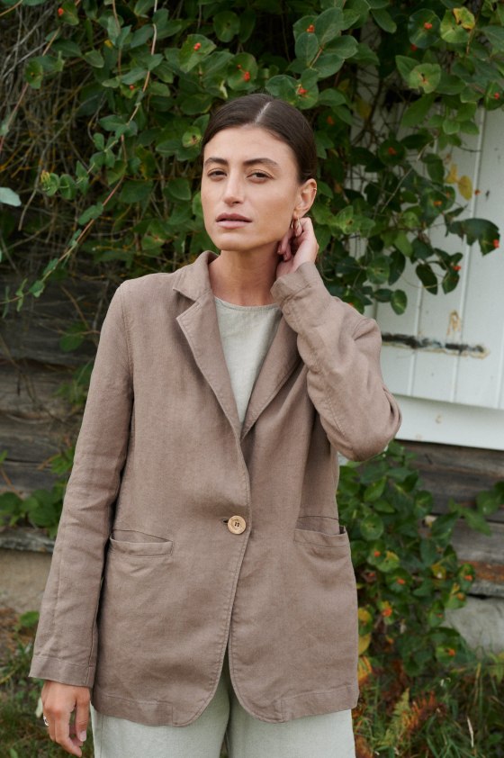 An oversized heavy linen blazer with notch lapels and a wooden closure