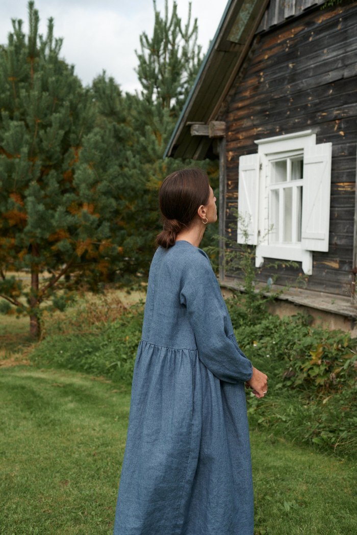 A woman wearing blue long sleeve dress from linen wool blend