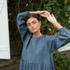 Linenfox model in a long sleeve wool linen dress