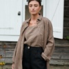 Heavy linen trousers in black paired with a cacao linen top and an unbuttoned linen shirt
