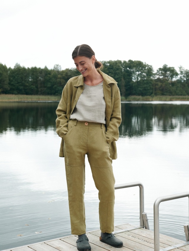 Heavy linen utility jacket and trousers outfit with a tucked in linen shirt