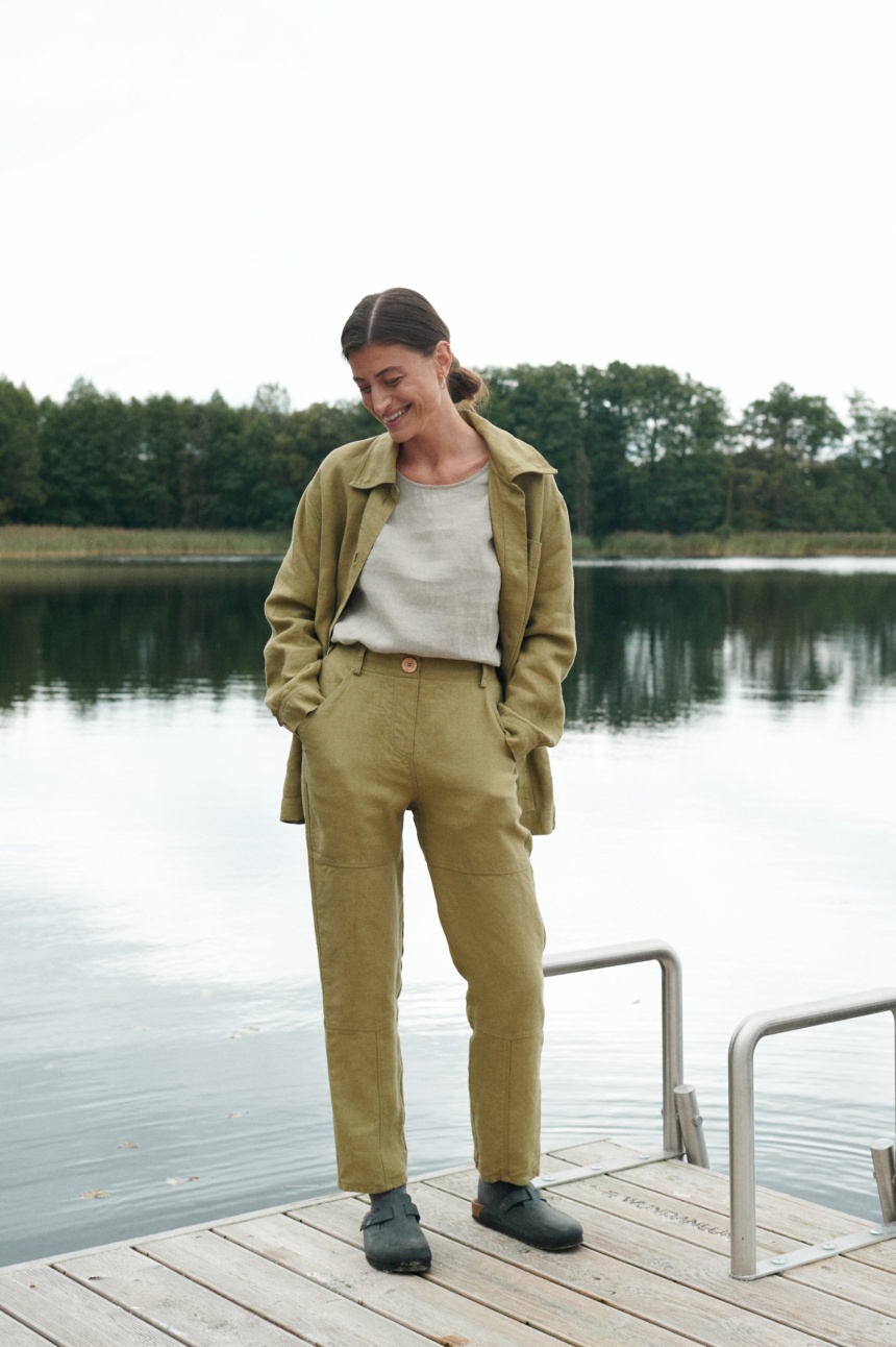 Heavy linen utility jacket and trousers outfit with a tucked in linen shirt