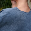 Back neckline details of a blue linen wool blend tunic
