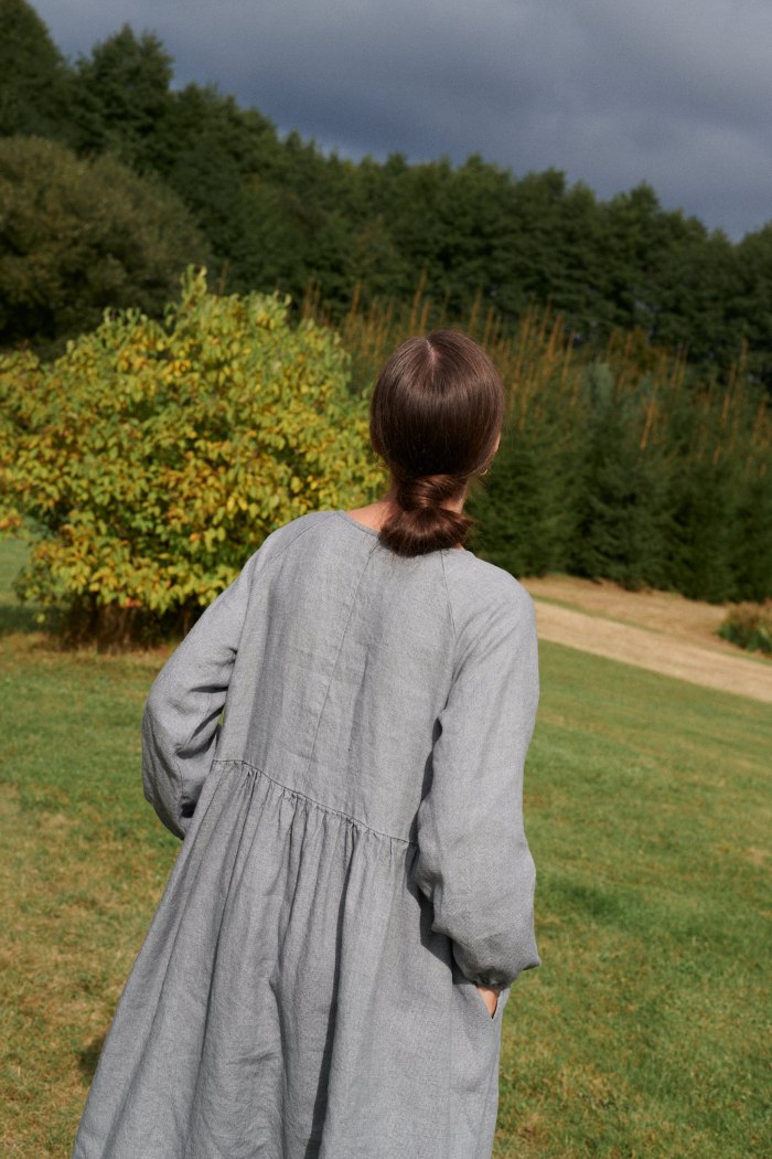 Back of an oversized grey linen wool dress