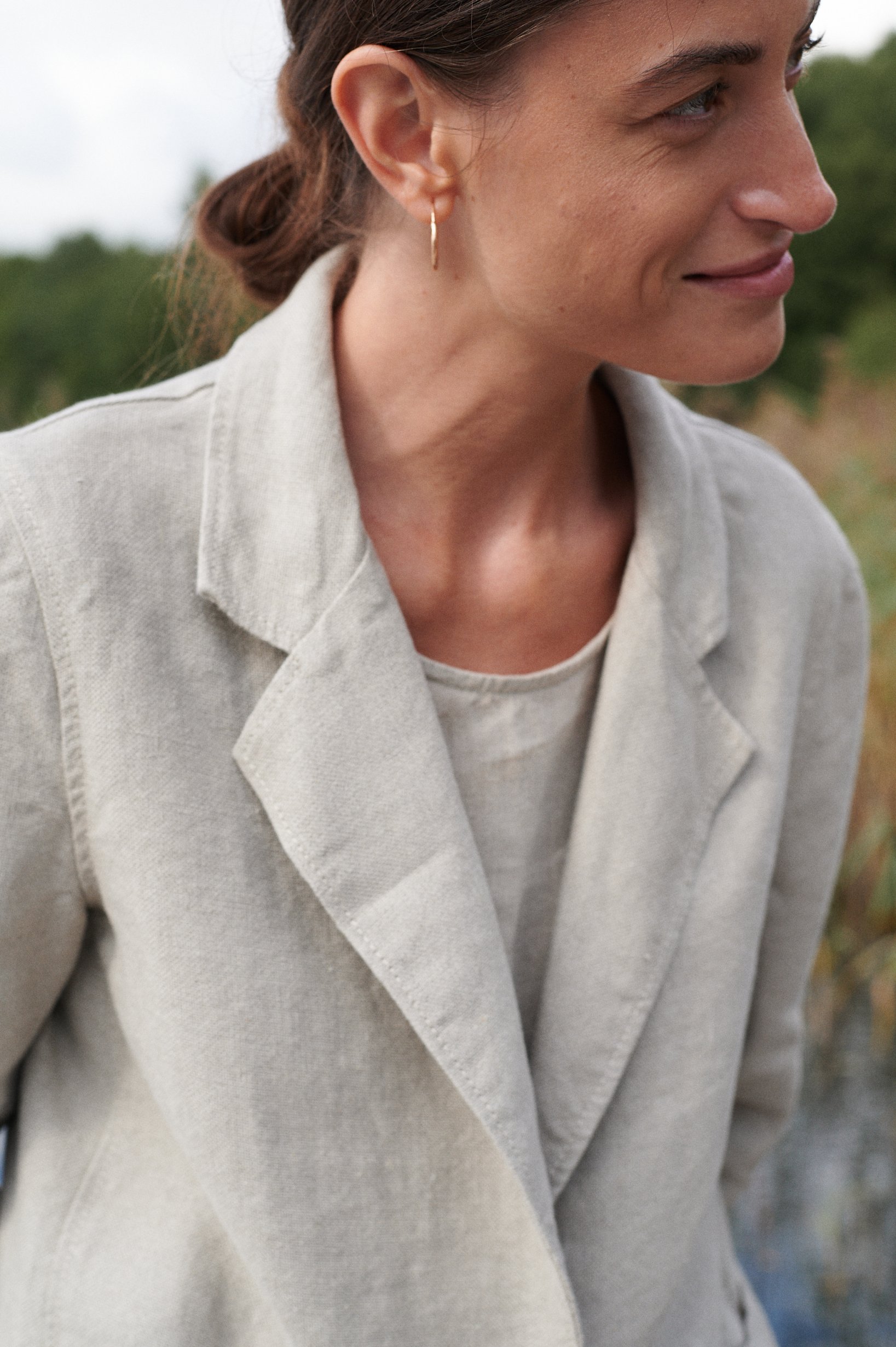 Lapel details of a heavy natural grey linen jacket