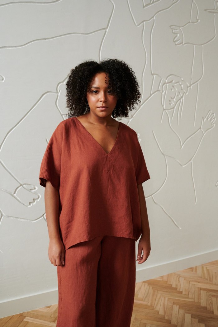 An oversized linen top with a V neckline and short sleeves