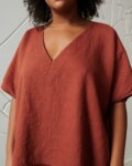 An oversized terracotta linen top with a V neckline