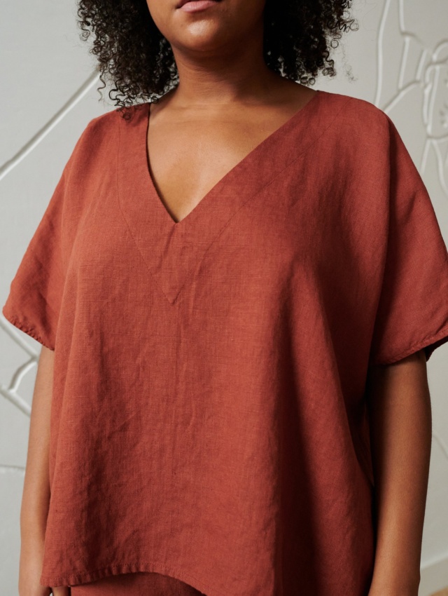 An oversized terracotta linen top with a V neckline