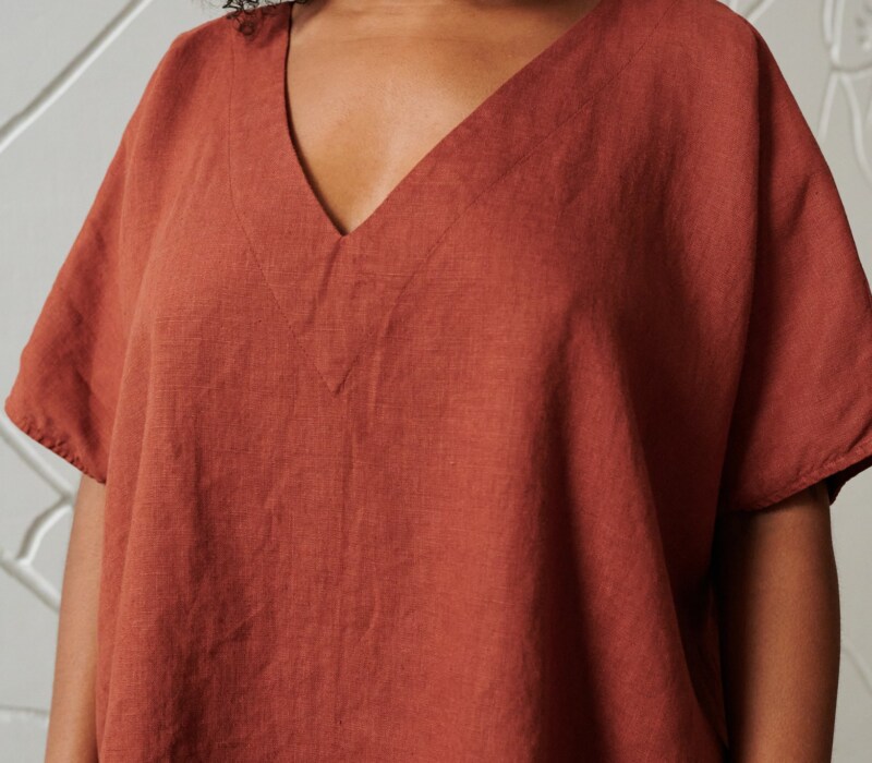 An oversized terracotta linen top with a V neckline