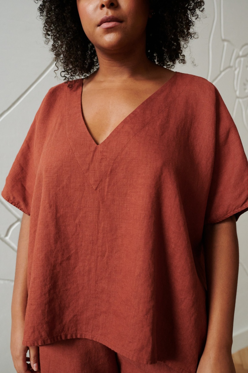 An oversized terracotta linen top with a V neckline