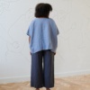 The back of sky blue linen one size top