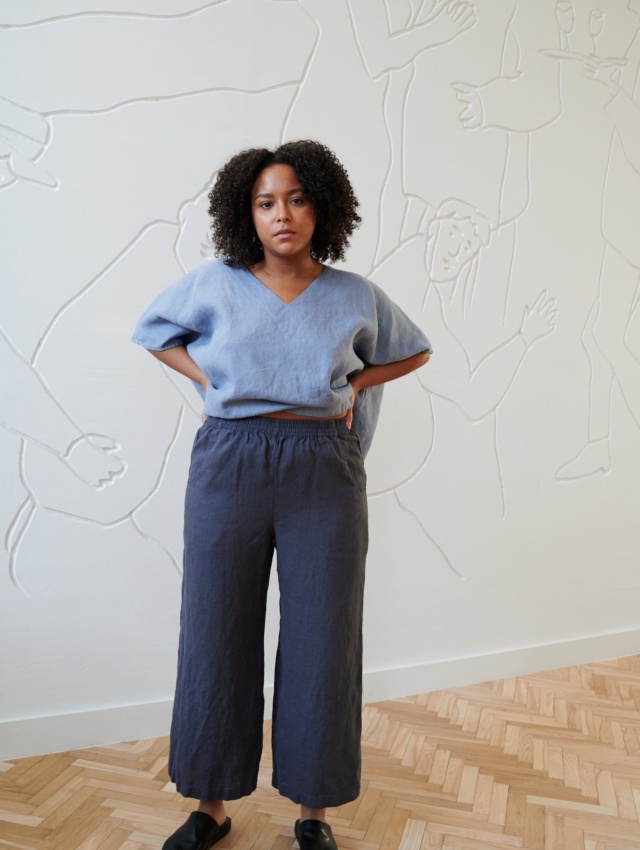 Blue linen oversized top tucked in wide leg trousers