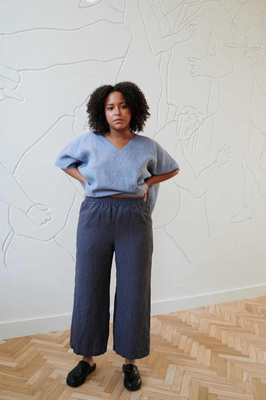 Blue linen oversized top tucked in wide leg trousers