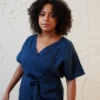 Navy blue linen jumpsuit with a V-neck and short sleeves