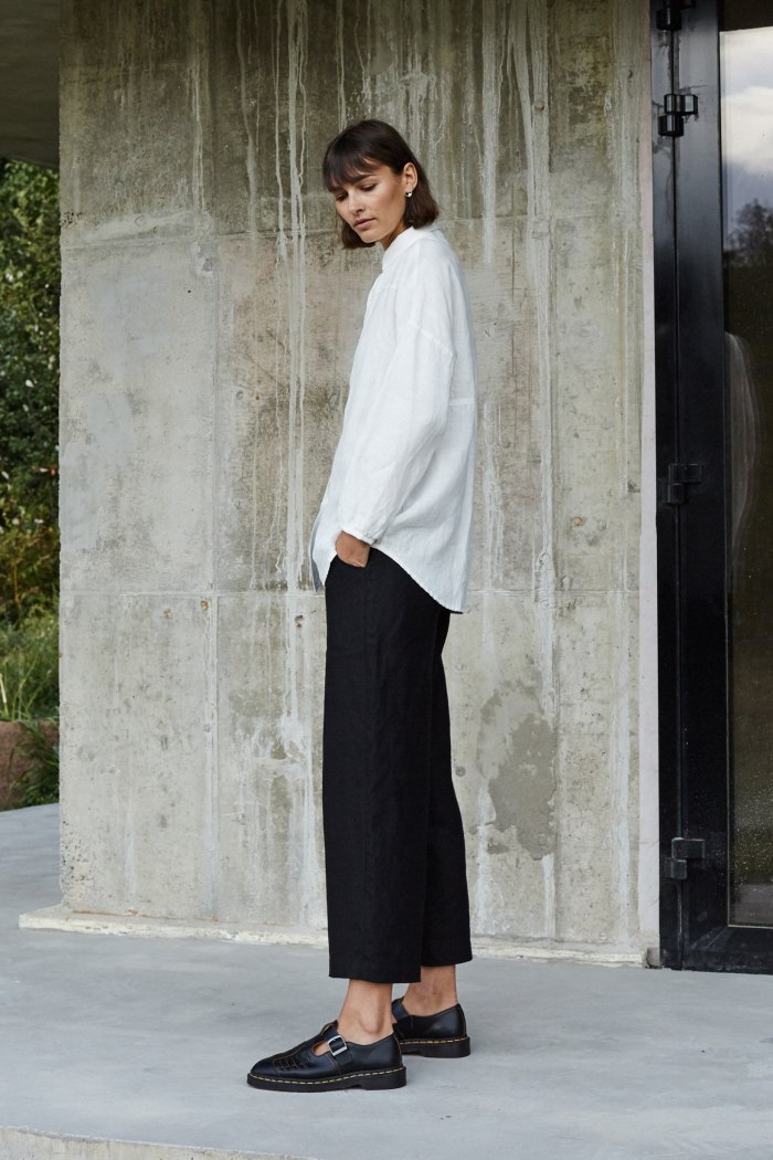 A model wearing heavy linen black trousers