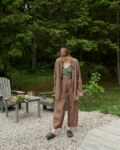 A girl in brown heavy linen trousers