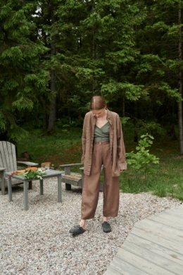 A girl in brown heavy linen trousers