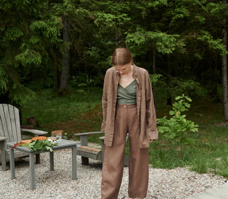 A girl in brown heavy linen trousers
