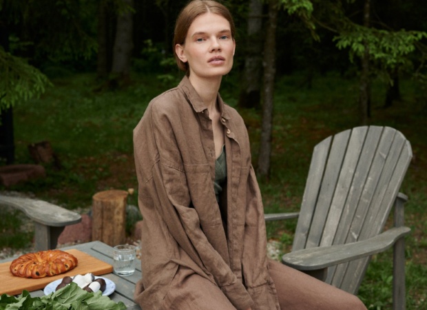 A linen button down shirt with drop-shoulders and a long hemline