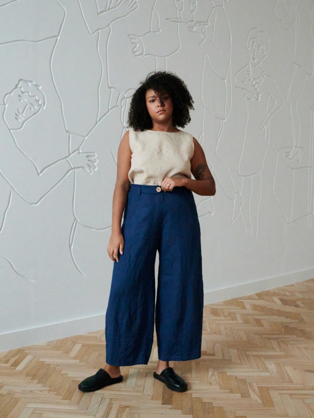 Model wearing navy blue linen trousers