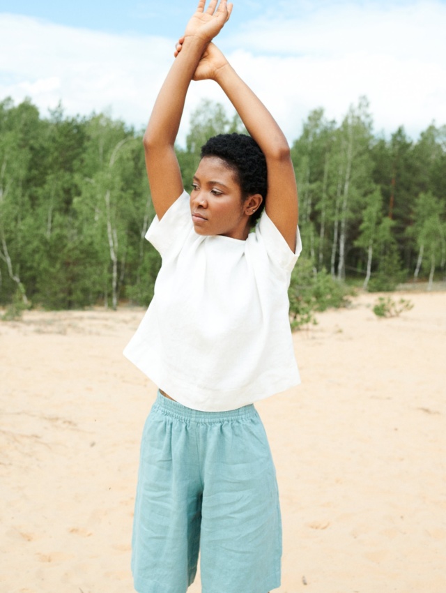 model wearing white linen top