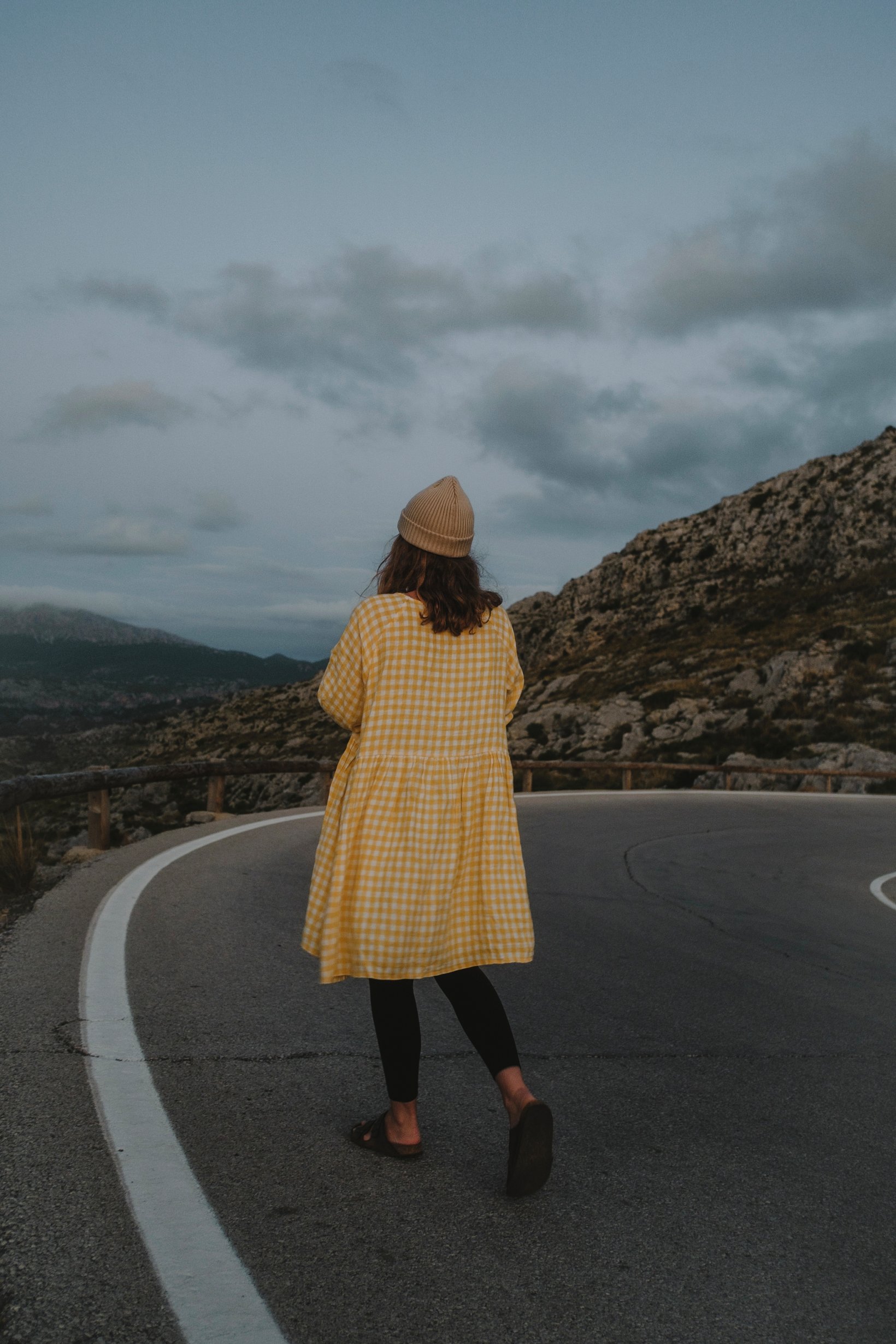 woman in the summer wearing yellow gingham linen dress 