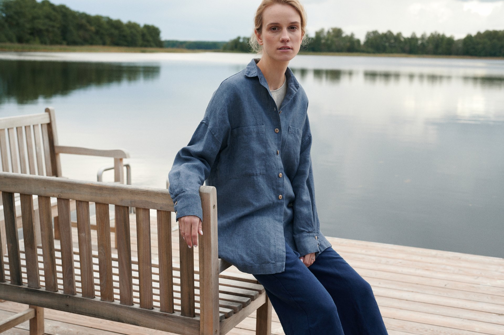 woman wearing linen and wool blend shirt, linen trousers, autumn and winter linens. nature surrounding woman in linens