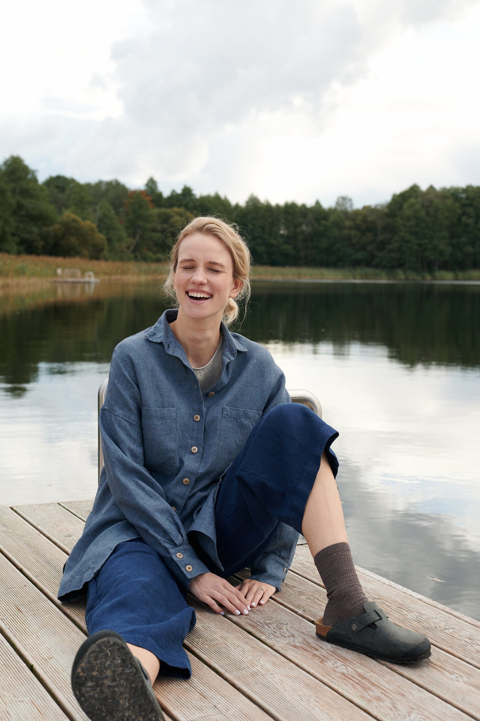 woman wearing linen and wool blend shirt, linen trousers, autumn and winter linens. nature surrounding woman in linens