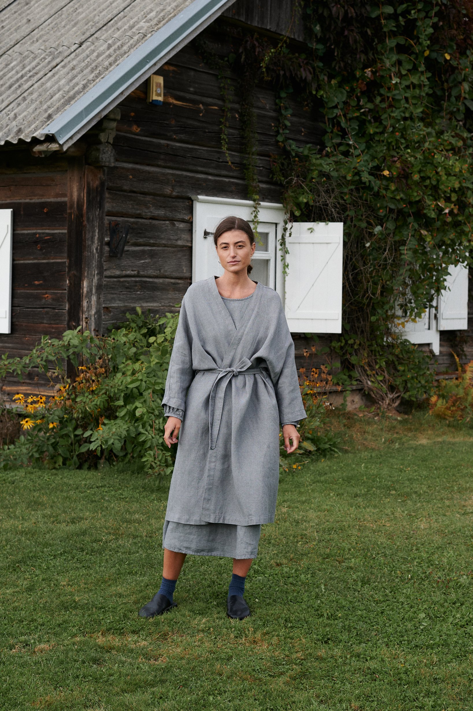 woman wearing linen and wool blend jacket, linen dress, autumn and winter linens. 