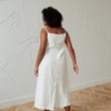 Back of a long slightly flared linen dress with thin straps