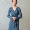 Model wearing blue wool blend dress