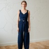 tapered linen trousers and a wrap top in dark navy