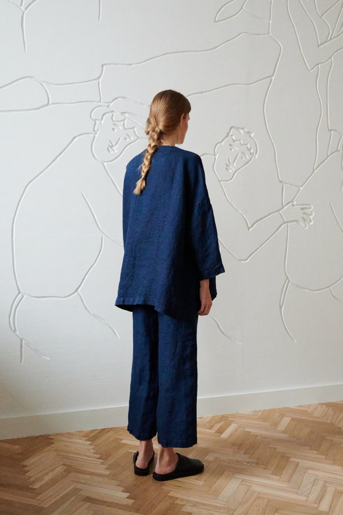 the back of oversized navy linen jacket and wide pants