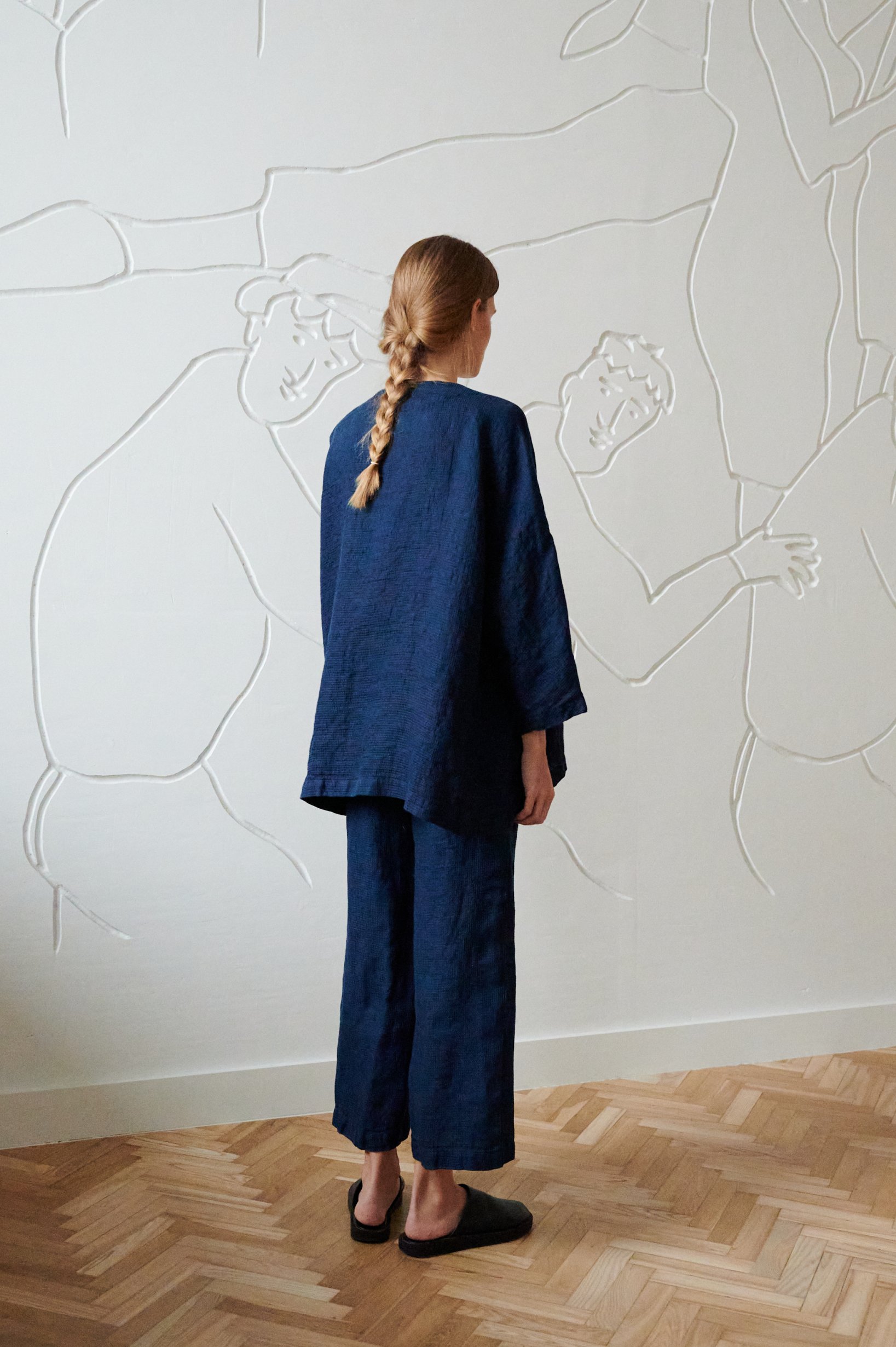 the back of oversized navy linen jacket and wide pants