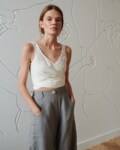 wide leg grey linen trousers with decorative button and pockets