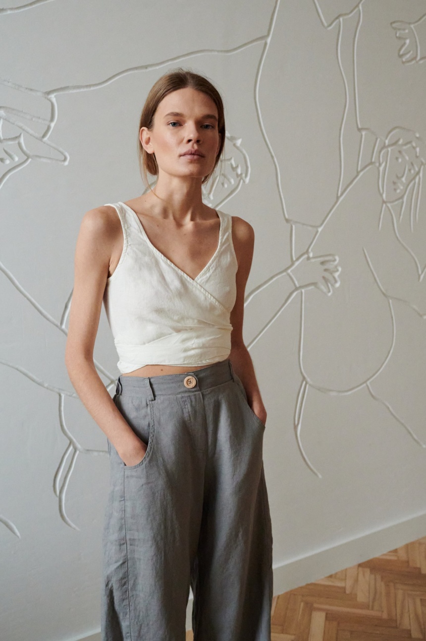 wide leg grey linen trousers with decorative button and pockets