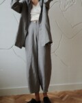 oversized linen barrel leg pants and a matching shirt in neutral grey