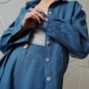 blue linen button down with wooden button cuffs