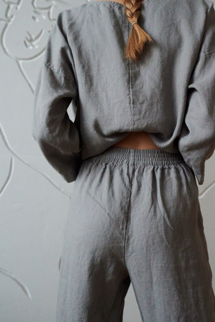 Back of grey linen trousers with an elasticated waist