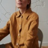 A utility style linen jacket with wooden buttons