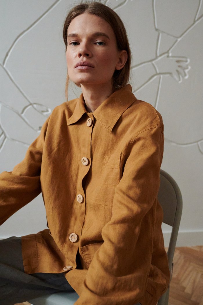 A utility style linen jacket with wooden buttons
