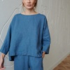 A blue oversized linen top with a high-low hem