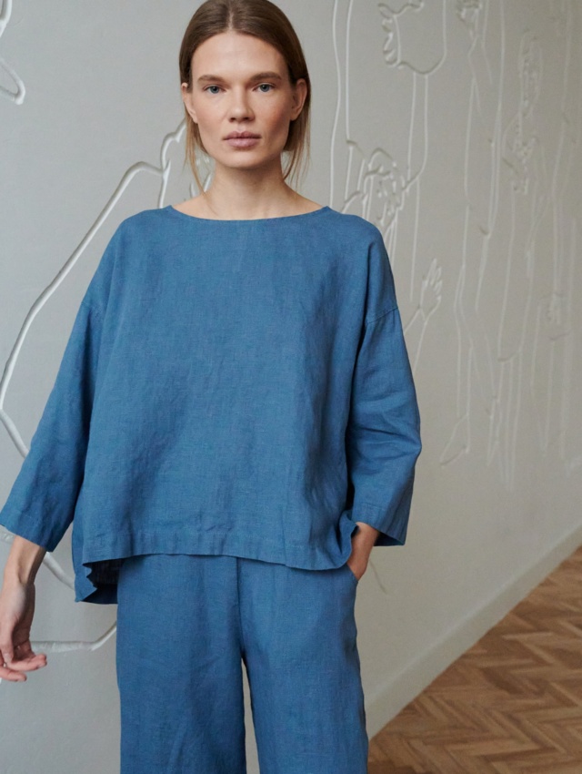 A blue oversized linen top with a high-low hem