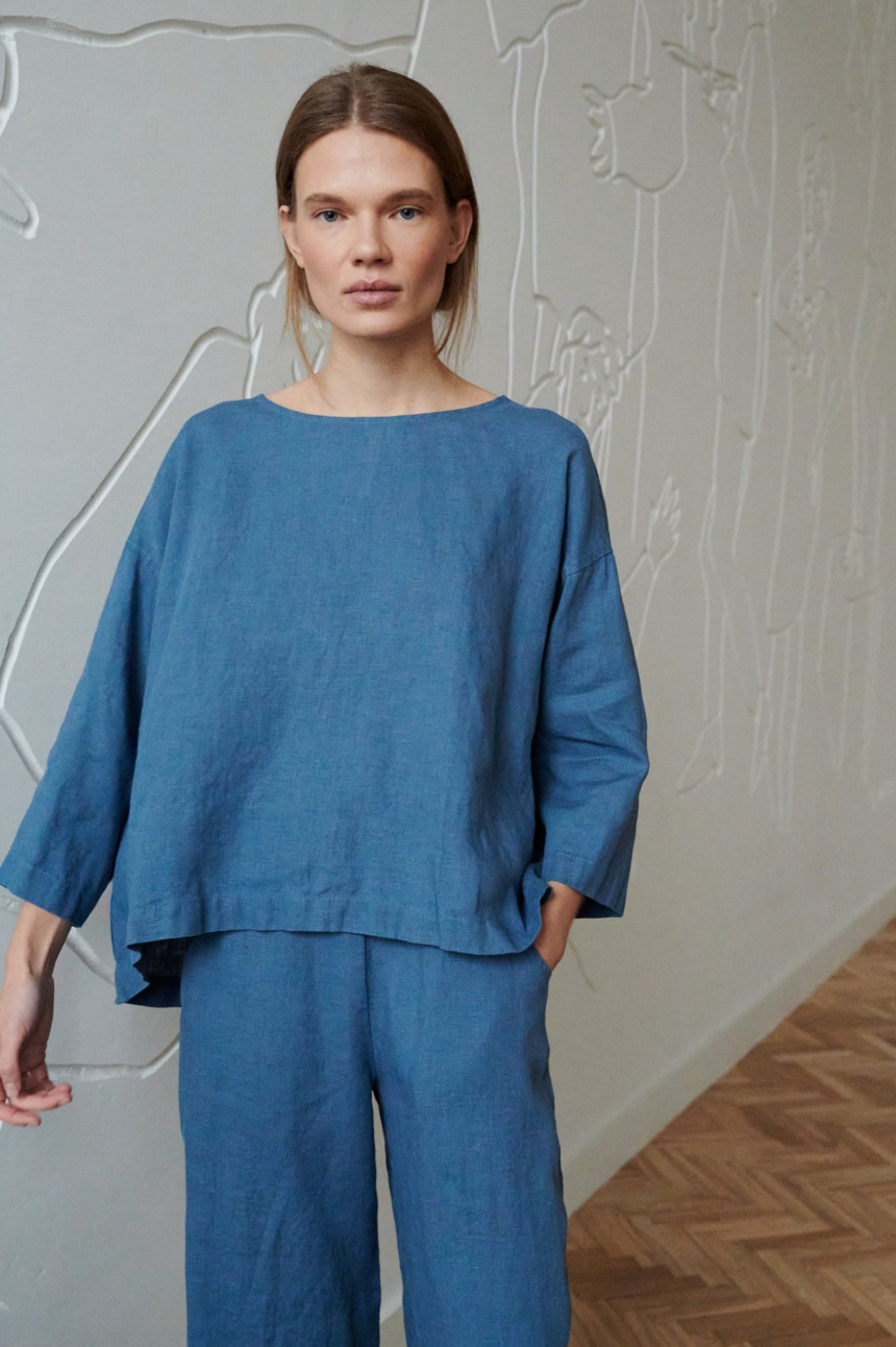 A blue oversized linen top with a high-low hem